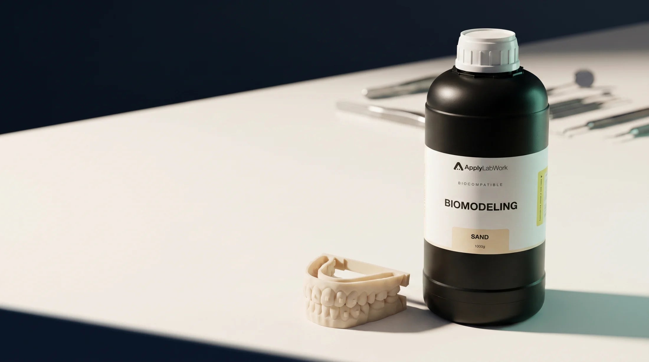 BioModeling Sand resin bottle and a sand-coloured printed dental model on a precision workbench